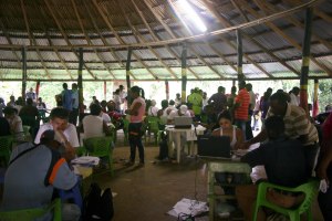 People receiving their cheques. 